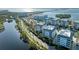Aerial view showing condo location, nearby waterway, and road at 395 Aruba Cir # 302, Bradenton, FL 34209