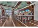 Community clubhouse bar with seating and multiple screens at 395 Aruba Cir # 302, Bradenton, FL 34209