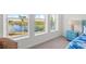 Bedroom with wicker chair and water views at 395 Aruba Cir # 302, Bradenton, FL 34209