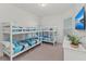 ' bedroom with two bunk beds and a TV at 395 Aruba Cir # 302, Bradenton, FL 34209