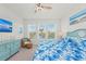 Spacious bedroom with large windows, king bed, and calming decor at 395 Aruba Cir # 302, Bradenton, FL 34209