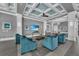 Clubhouse lounge with comfortable seating and a large TV at 395 Aruba Cir # 302, Bradenton, FL 34209