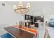 Elegant dining room with chandelier and coastal-inspired decor at 395 Aruba Cir # 302, Bradenton, FL 34209