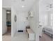 Bright condo entryway with tiled floor and storage bench at 395 Aruba Cir # 302, Bradenton, FL 34209