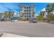 Condo building exterior showcasing architectural details and landscaping at 395 Aruba Cir # 302, Bradenton, FL 34209