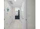 Clean hallway with tile floors and access to multiple rooms at 395 Aruba Cir # 302, Bradenton, FL 34209