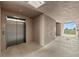 Clean and bright condo hallway with elevator and exit at 395 Aruba Cir # 302, Bradenton, FL 34209
