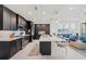 Eat-in kitchen with island, stainless steel appliances, and dark cabinets at 395 Aruba Cir # 302, Bradenton, FL 34209