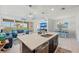 Open concept kitchen with large island, stainless steel appliances, and dark cabinets at 395 Aruba Cir # 302, Bradenton, FL 34209