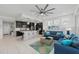 Open living and kitchen area with island and comfortable seating at 395 Aruba Cir # 302, Bradenton, FL 34209