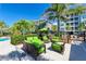 Outdoor seating area with green couches and chairs at 395 Aruba Cir # 302, Bradenton, FL 34209