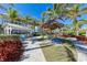 Relaxing outdoor seating area with thatched umbrellas at 395 Aruba Cir # 302, Bradenton, FL 34209