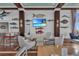 Clubhouse seating area with nautical decor and TV at 395 Aruba Cir # 302, Bradenton, FL 34209