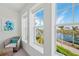 Sitting area with wicker chair and water views at 395 Aruba Cir # 302, Bradenton, FL 34209