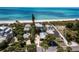 Beachfront property aerial view showcasing home and ocean at 409 Casey Key Rd, Nokomis, FL 34275
