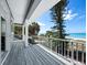 Oceanfront balcony with wooden decking and railings at 409 Casey Key Rd, Nokomis, FL 34275