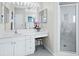 Bathroom with vanity, sink, and walk-in shower at 409 Casey Key Rd, Nokomis, FL 34275