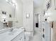 Bathroom with vanity, toilet, and mirrored medicine cabinet at 409 Casey Key Rd, Nokomis, FL 34275