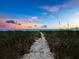Pathway to beach at sunset at 409 Casey Key Rd, Nokomis, FL 34275