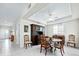 Formal dining room with wooden table and chairs, and a hutch at 409 Casey Key Rd, Nokomis, FL 34275