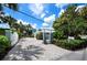 Home with gated entrance and brick driveway at 409 Casey Key Rd, Nokomis, FL 34275