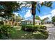 Detached garage with lush landscaping at 409 Casey Key Rd, Nokomis, FL 34275