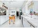 White kitchen with butcher block island and stainless steel appliances at 409 Casey Key Rd, Nokomis, FL 34275
