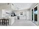 Bright kitchen with white cabinets and tile floors at 409 Casey Key Rd, Nokomis, FL 34275
