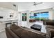 Spacious living room with ocean view and comfy sofas at 409 Casey Key Rd, Nokomis, FL 34275