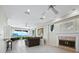 Spacious living room with fireplace, tiled floors, and ocean views at 409 Casey Key Rd, Nokomis, FL 34275