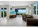 Relaxing room with ocean view and sliding glass doors at 409 Casey Key Rd, Nokomis, FL 34275