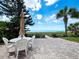 Beachfront patio with table and chairs at 409 Casey Key Rd, Nokomis, FL 34275