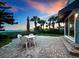 Brick patio with outdoor dining set at 409 Casey Key Rd, Nokomis, FL 34275