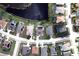 Aerial view of a single-Gathering home with a pool, situated in a residential neighborhood at 4111 Hemingway Dr, Venice, FL 34293