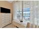 Bedroom with a desk, large windows with water view, and a ceiling fan at 4111 Hemingway Dr, Venice, FL 34293