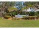 Welcoming community entrance with landscaping and signage at 4111 Hemingway Dr, Venice, FL 34293