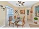 Spacious dining area includes glass table and wicker chairs at 4111 Hemingway Dr, Venice, FL 34293