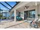 Relaxing lanai with patio furniture and pool access at 4111 Hemingway Dr, Venice, FL 34293
