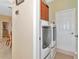 Convenient laundry room with washer, dryer, and extra storage at 4111 Hemingway Dr, Venice, FL 34293