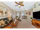 Spacious living room with sofa and flat-screen TV at 4111 Hemingway Dr, Venice, FL 34293