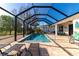 Enclosed pool area with patio furniture and lake view at 4111 Hemingway Dr, Venice, FL 34293