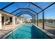 Relaxing screened-in pool with lake views at 4111 Hemingway Dr, Venice, FL 34293