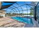 Enclosed pool and lanai with lake view; perfect for relaxing at 4111 Hemingway Dr, Venice, FL 34293