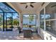 Relaxing screened patio with seating area, perfect for outdoor dining at 4111 Hemingway Dr, Venice, FL 34293