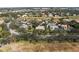 Aerial view of a luxury golf course community with numerous houses at 4214 Palacio Dr, Sarasota, FL 34238