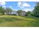 Landscaped backyard with lush lawn at 4214 Palacio Dr, Sarasota, FL 34238