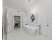 Spa-like bathroom with soaking tub, walk-in shower, and modern fixtures at 4214 Palacio Dr, Sarasota, FL 34238