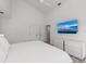 King bedroom with mounted TV and dresser at 4214 Palacio Dr, Sarasota, FL 34238