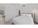 Bedroom with queen bed, access to bathroom, and pool view at 4214 Palacio Dr, Sarasota, FL 34238