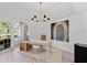 Light-filled home office with built-in shelving and large windows at 4214 Palacio Dr, Sarasota, FL 34238